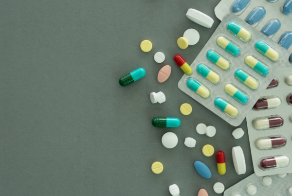 Various medications and pills laid across a flat surface